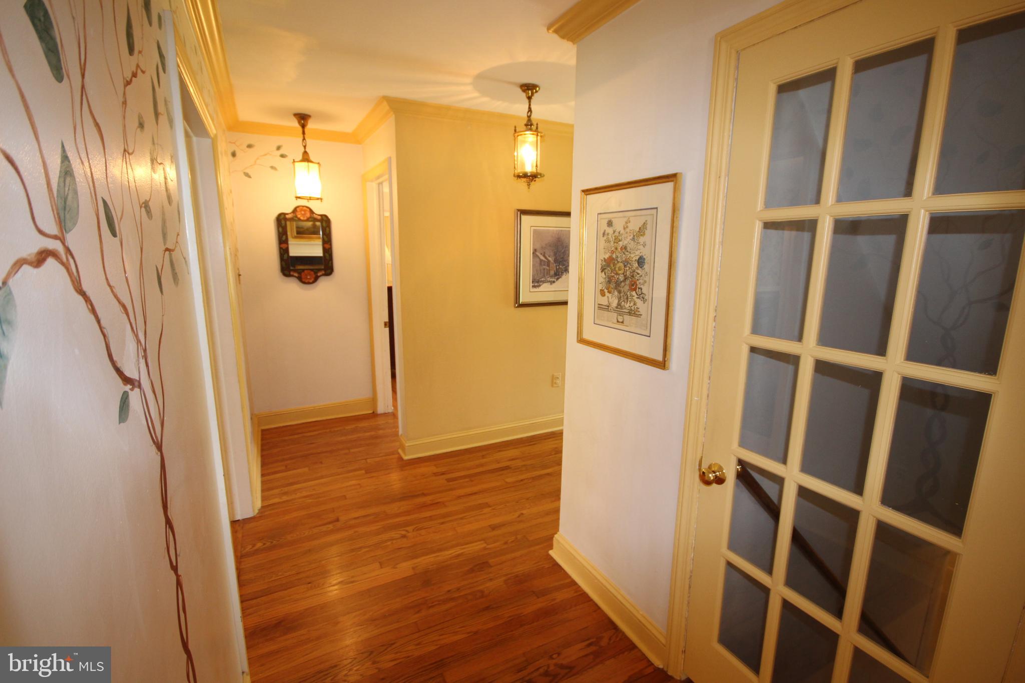 1008 Evergreen Road Yardley, PA 19067 - Photo 13 of 74 main hallway with primary bedroom straight ahead