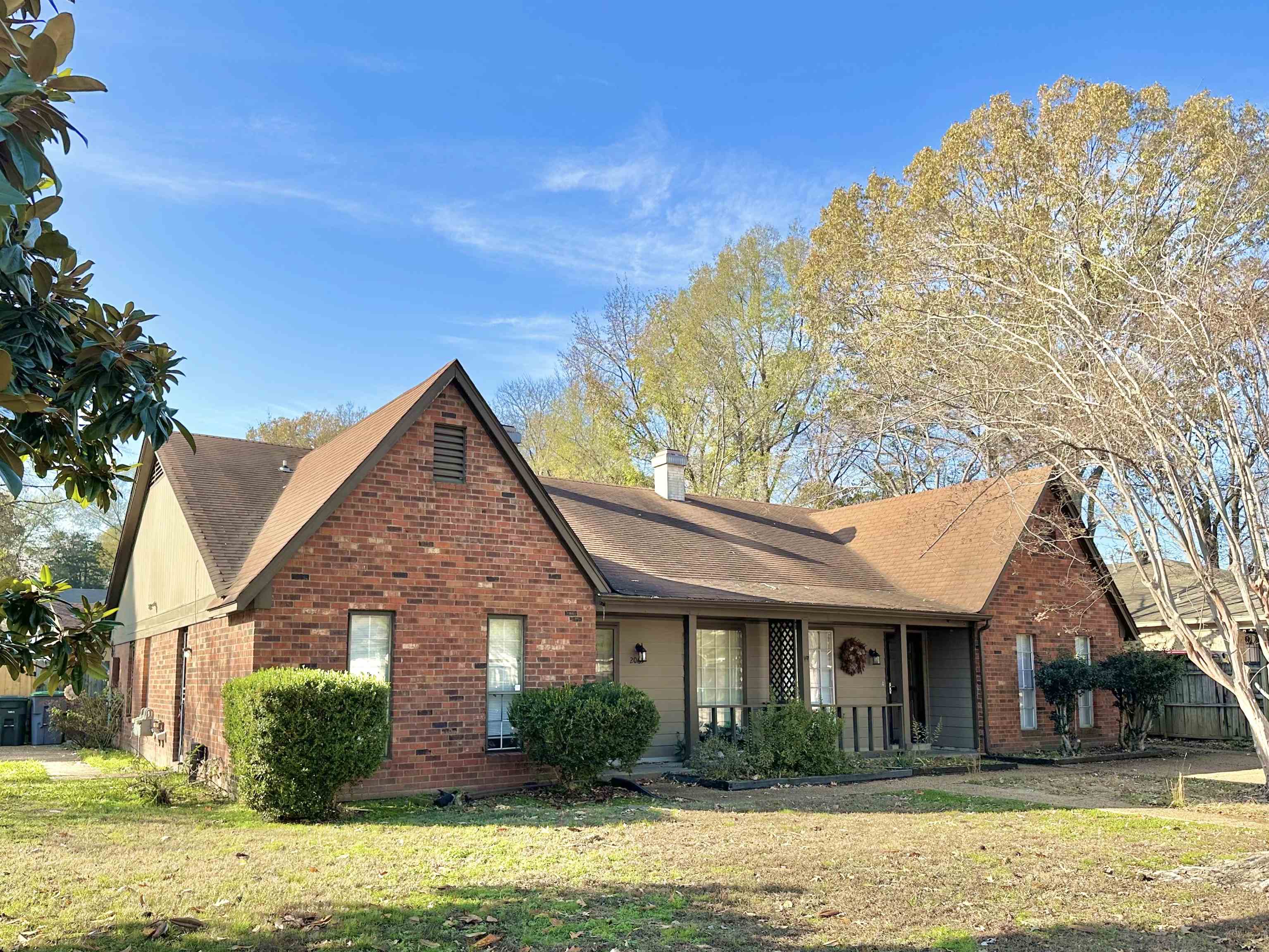 2065 Goldbrier Lane, Unit 2067 Memphis, TN 38134 - Photo 1 of 22 a front view of a house with a yard
