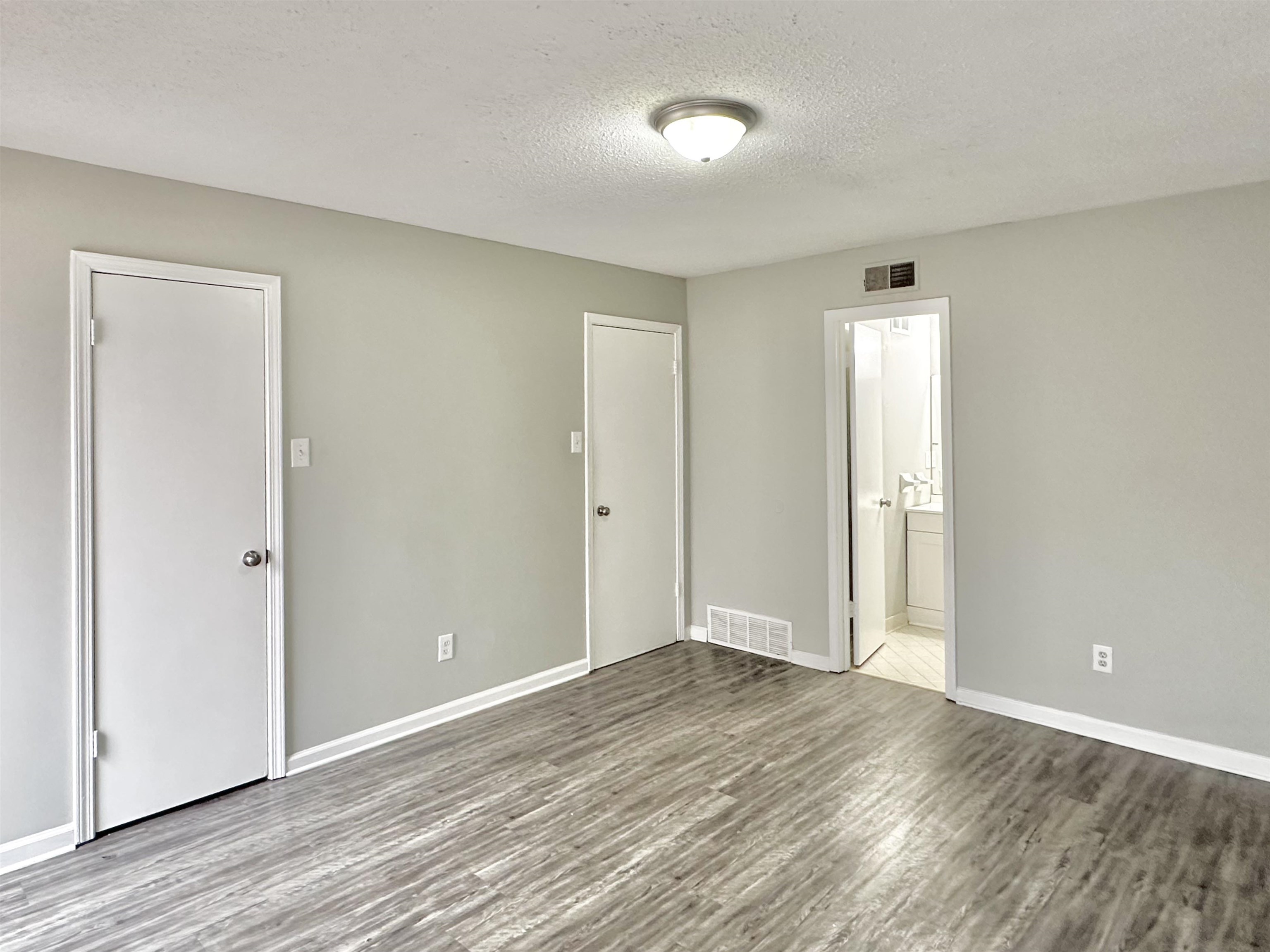 2065 Goldbrier Lane, Unit 2067 Memphis, TN 38134 - Photo 11 of 22 a view of an empty room and wooden floor