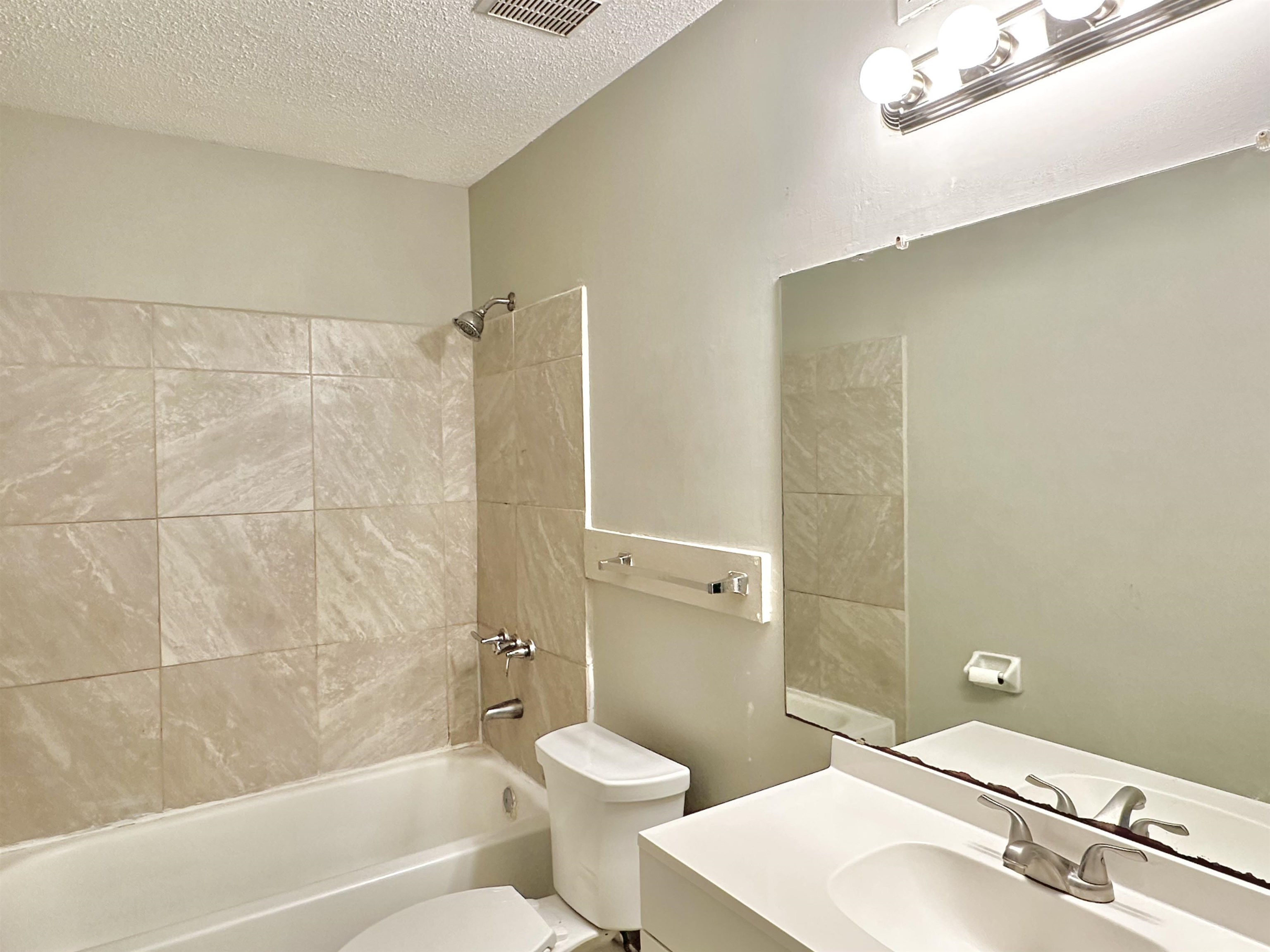 2065 Goldbrier Lane, Unit 2067 Memphis, TN 38134 - Photo 16 of 22 a bathroom with a sink toilet and shower