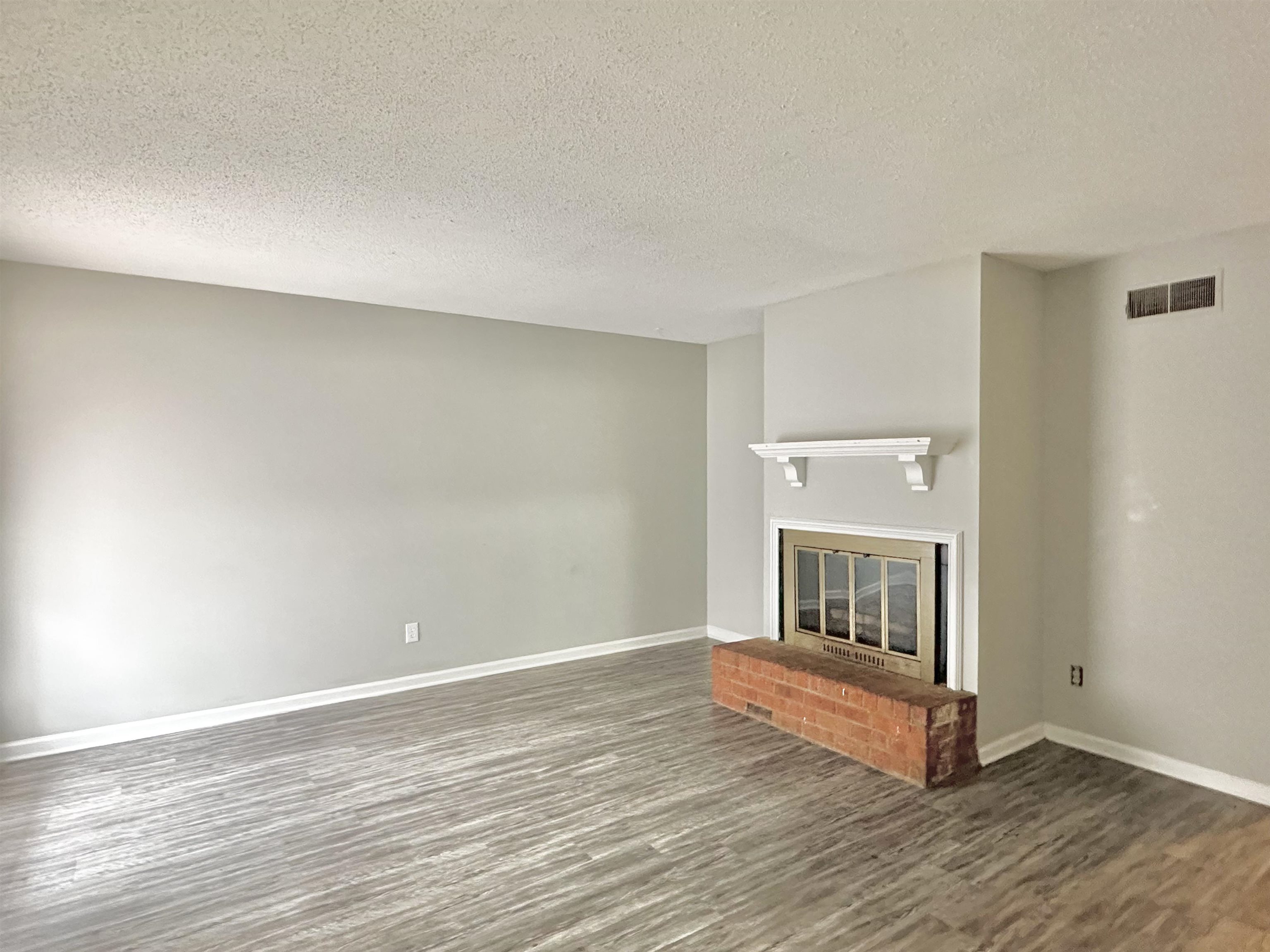 2065 Goldbrier Lane, Unit 2067 Memphis, TN 38134 - Photo 17 of 22 a view of a livingroom with wooden floor
