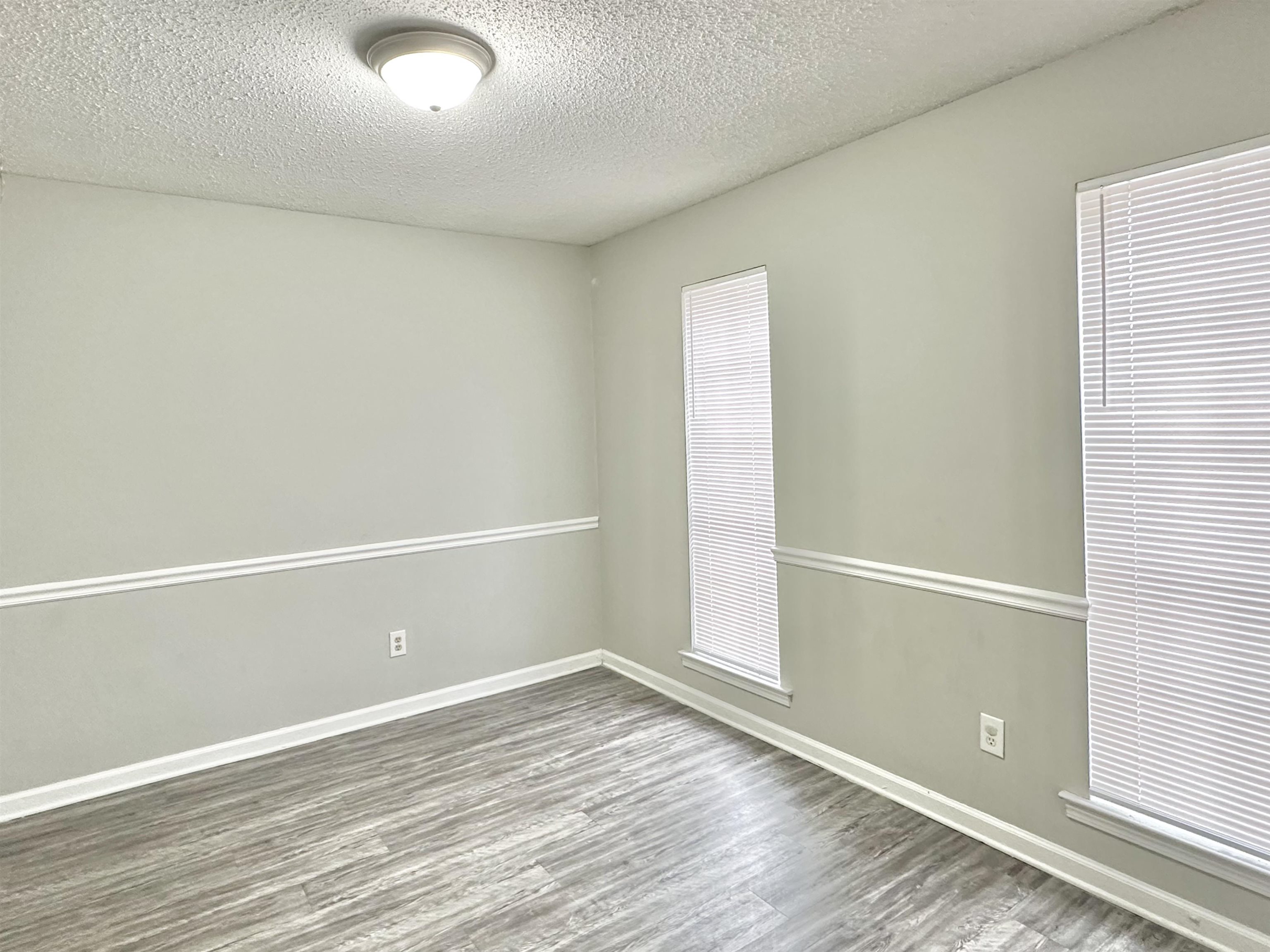 2065 Goldbrier Lane, Unit 2067 Memphis, TN 38134 - Photo 19 of 22 an empty room with wooden floor and window