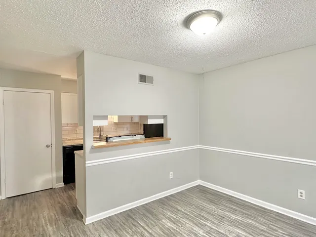 a view of a kitchen with a sink and dishwasher
