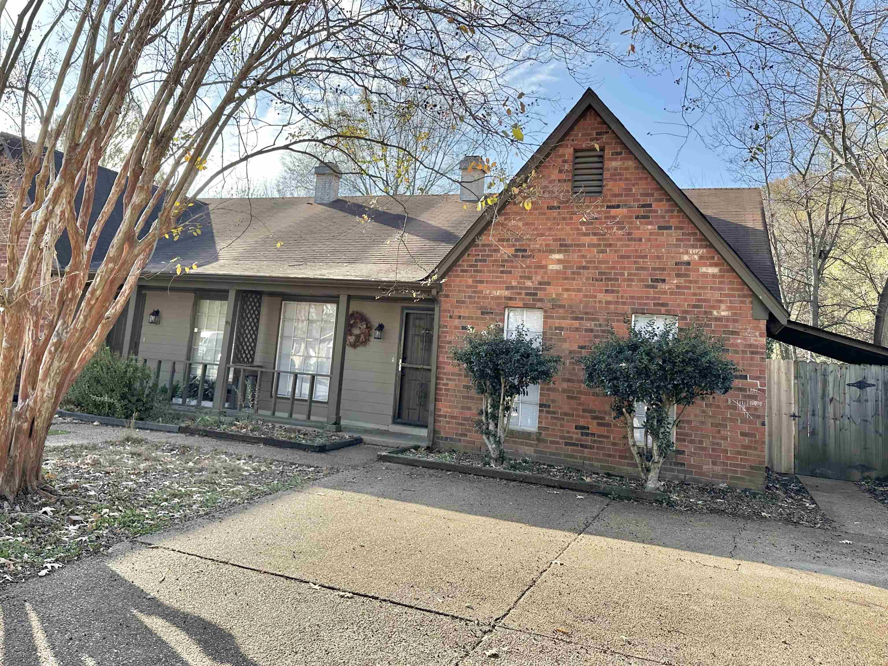 2065 Goldbrier Lane, Unit 2067 Memphis, TN 38134 - Photo 2 of 22 a view of a large house with a tree in front