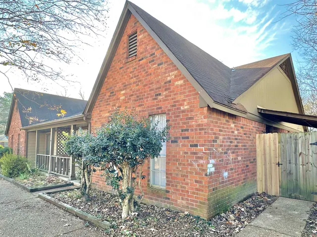 a brick building with a large windows