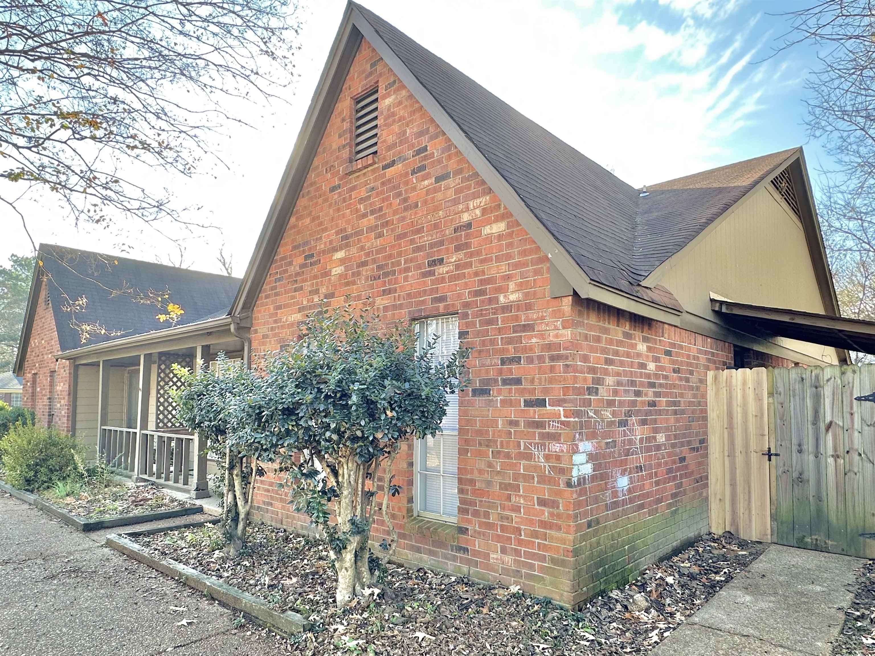 2065 Goldbrier Lane, Unit 2067 Memphis, TN 38134 - Photo 4 of 22 a brick building with a large windows