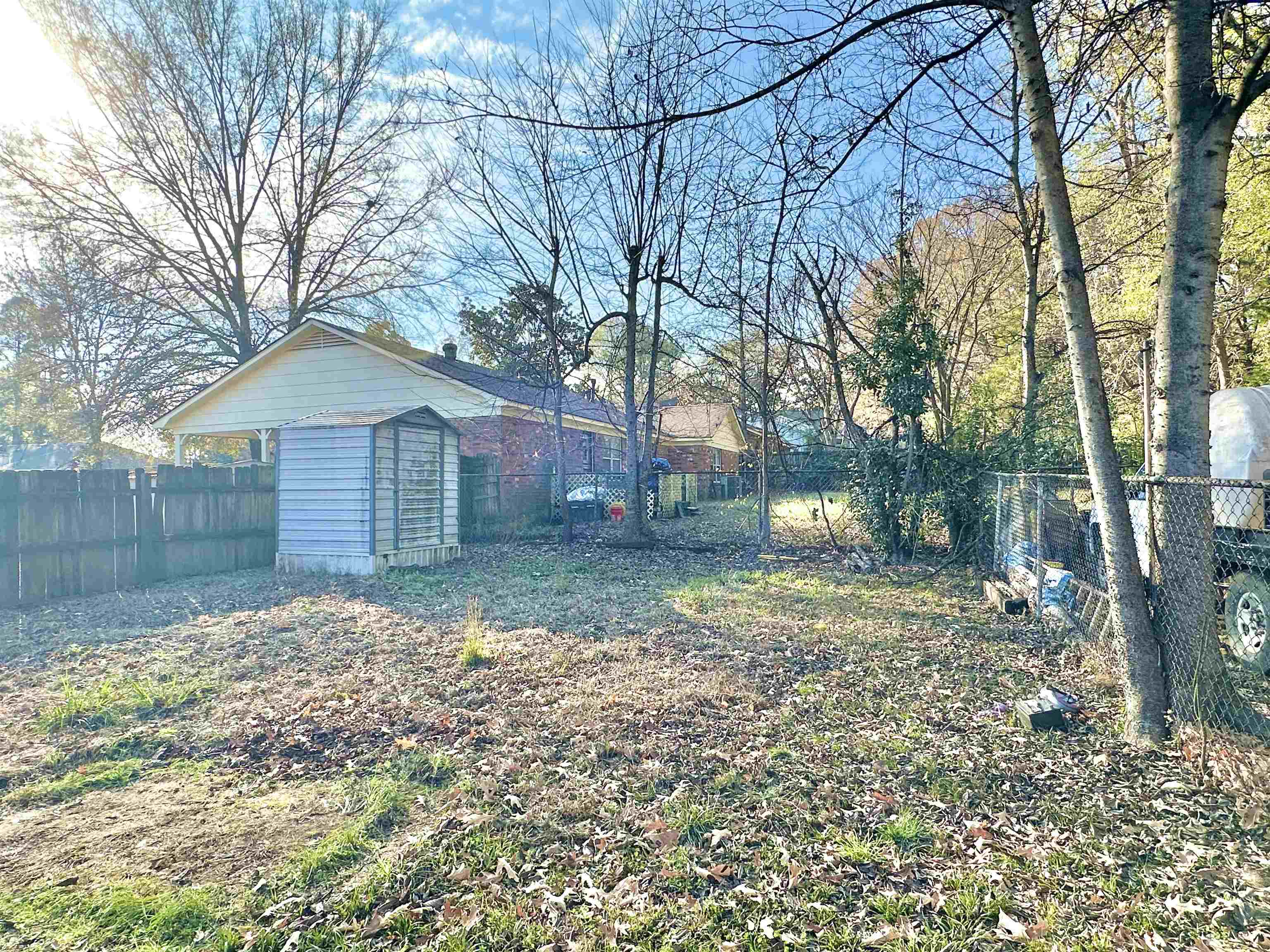 2065 Goldbrier Lane, Unit 2067 Memphis, TN 38134 - Photo 6 of 22 a backyard of a house with lots of green space