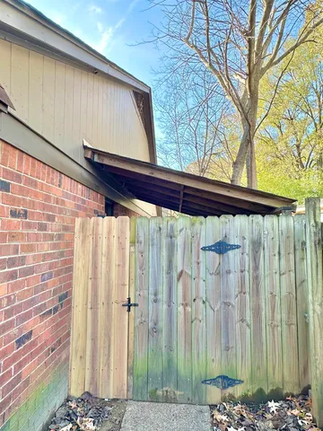 a front view of a house with a street