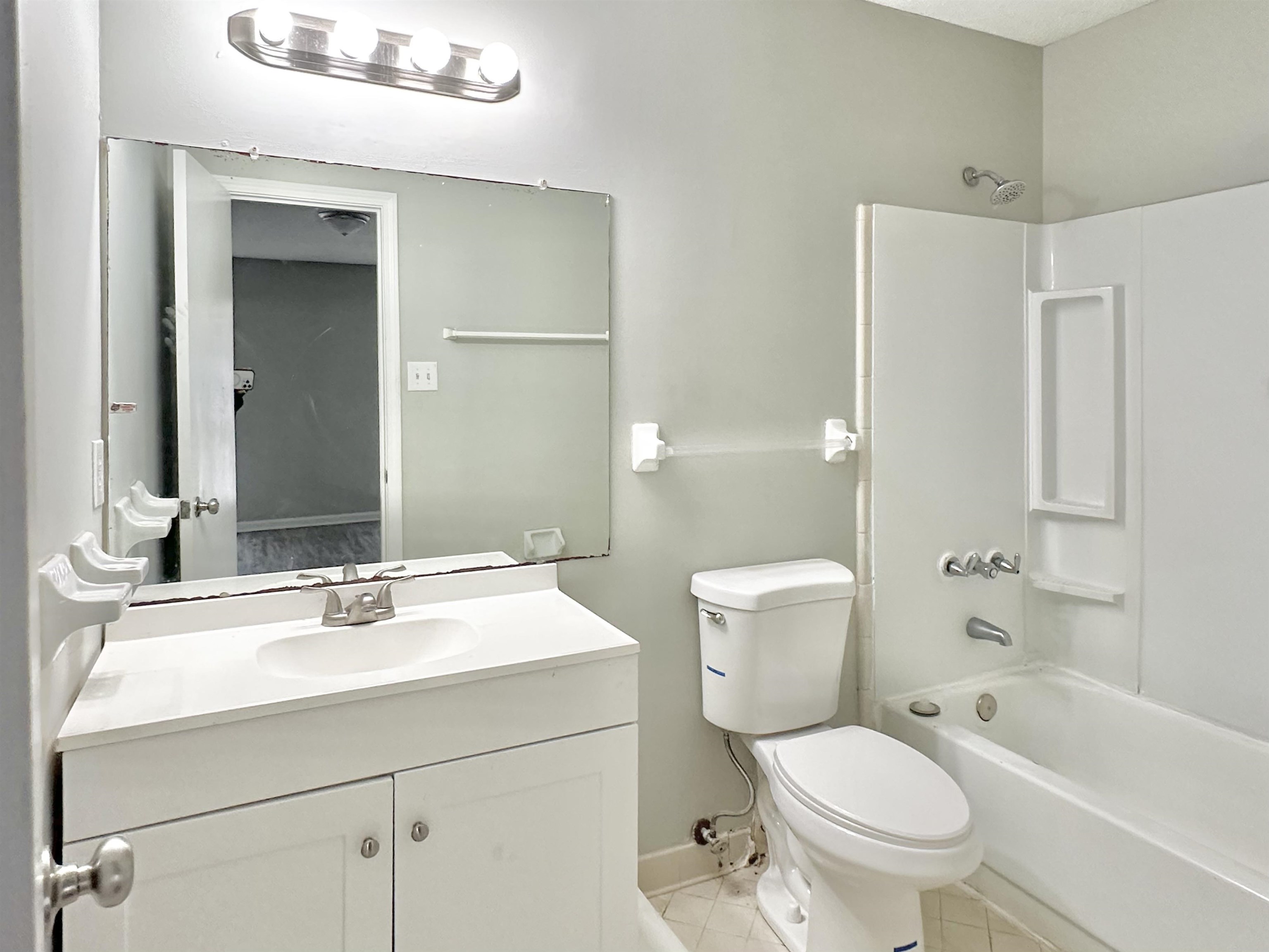 2065 Goldbrier Lane, Unit 2067 Memphis, TN 38134 - Photo 8 of 22 a bathroom with a sink toilet tub and shower