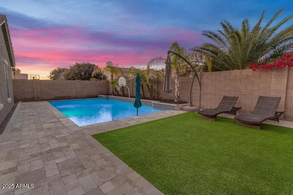 a view of a backyard with a patio