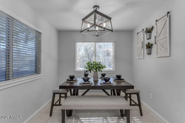 a view of a dining room with furniture window and outside view