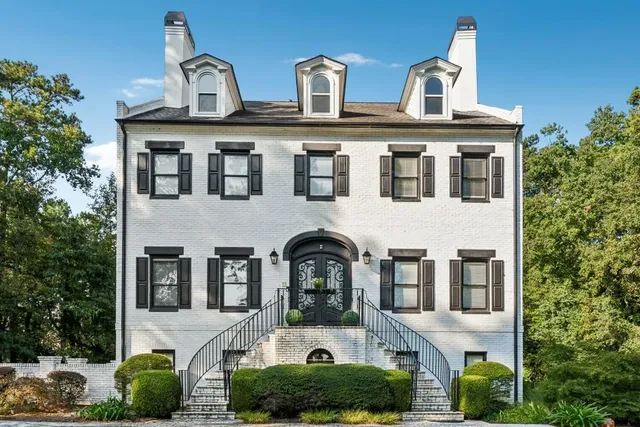 a front view of a building with garden