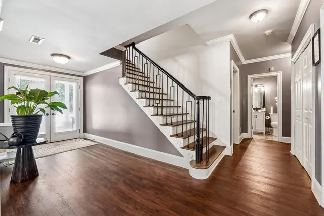 a view of an entryway with wooden floor