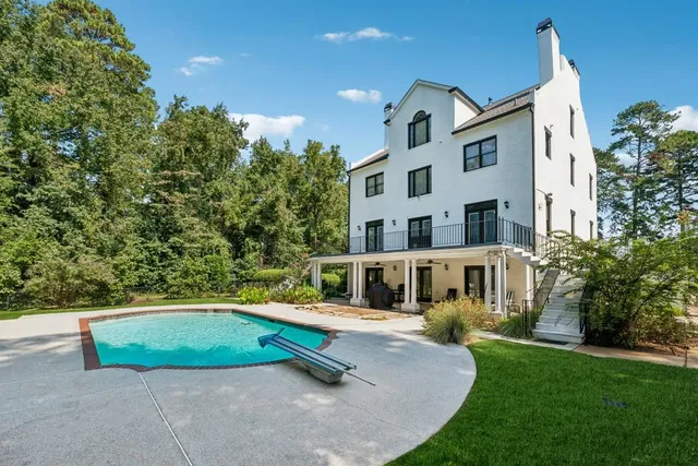 swimming pool view with a outdoor seating