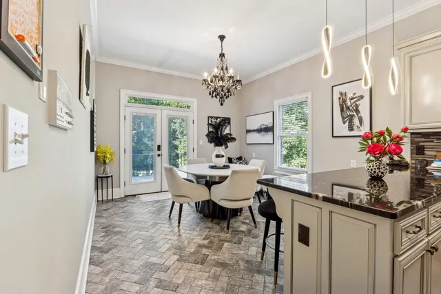 a view of a dining room with furniture and window