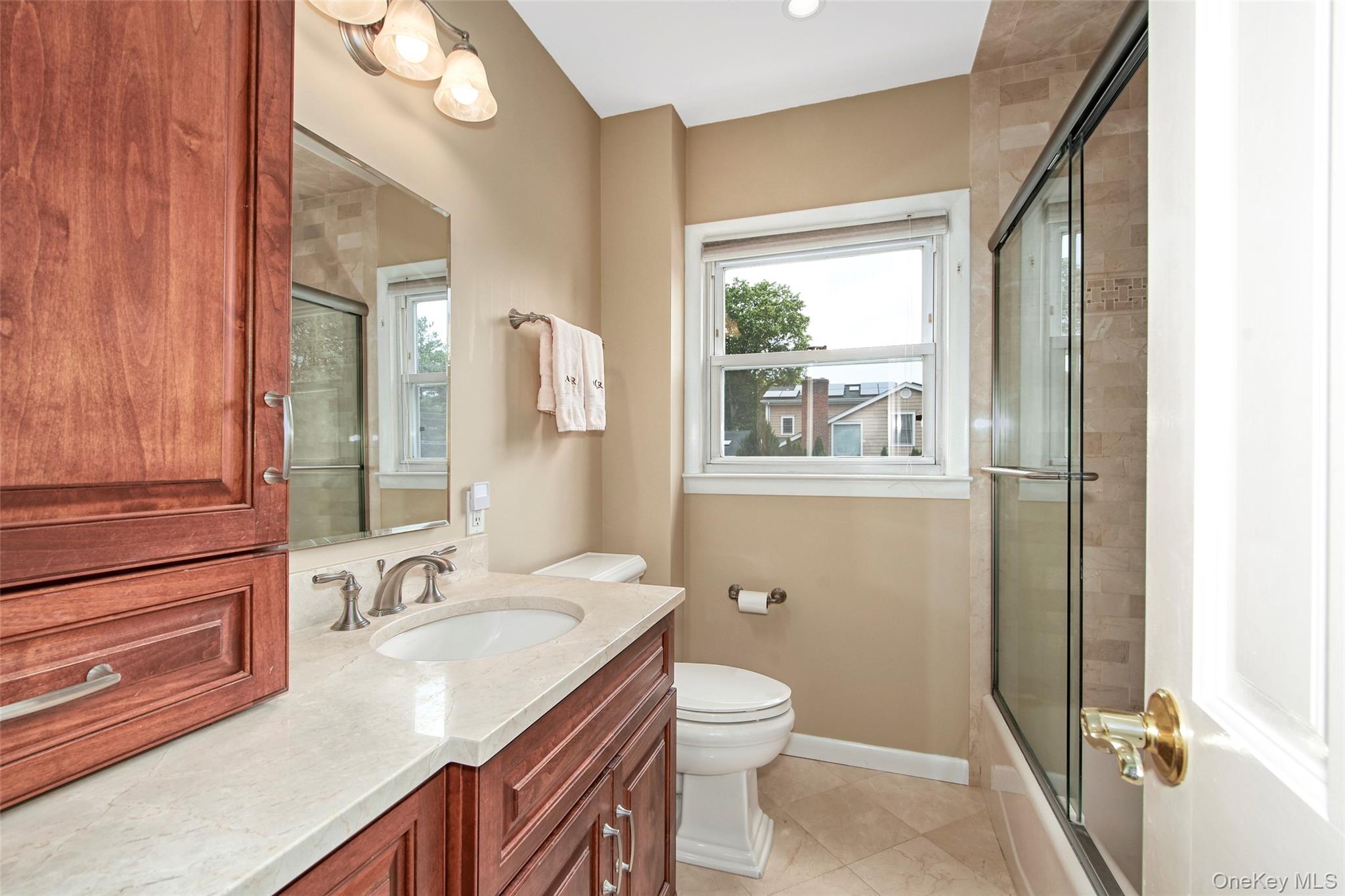 3 Bonwit Road Rye Brook, NY 10573 - Photo 21 of 31 Bright, updated full bathroom with tub and shower