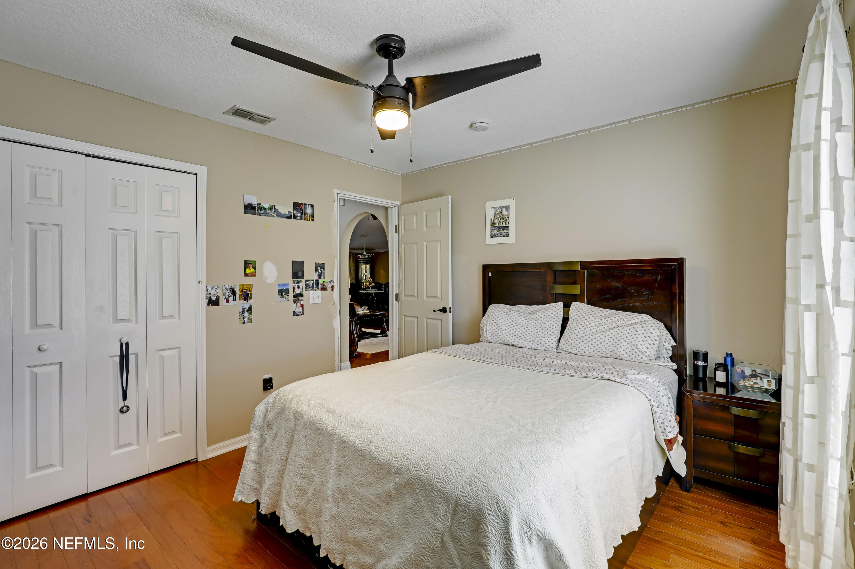 12559 Reeding Ridge Drive North Jacksonville, FL 32225 - Photo 11 of 42 a bedroom with a bed and a chandelier
