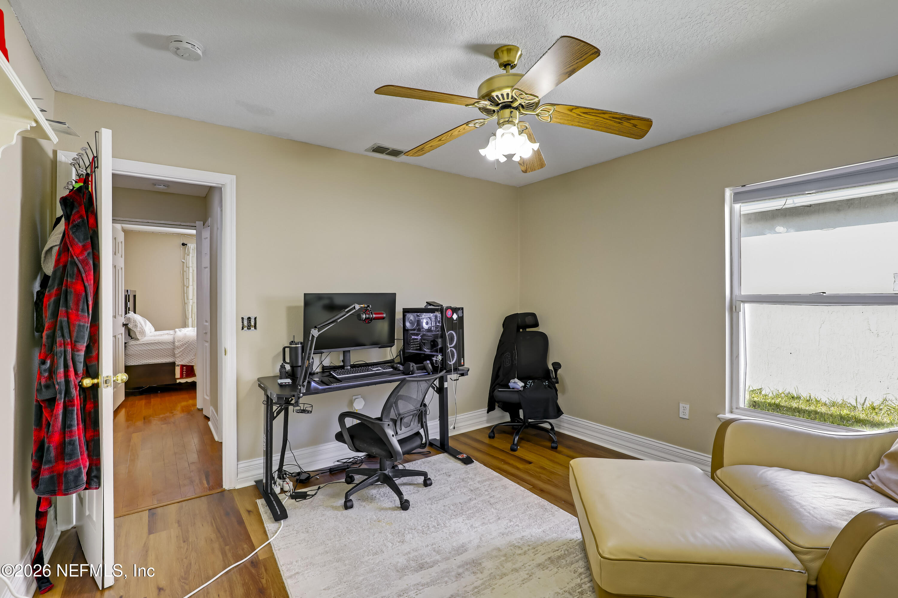 12559 Reeding Ridge Drive North Jacksonville, FL 32225 - Photo 14 of 42 a view of a workspace with furniture and a window