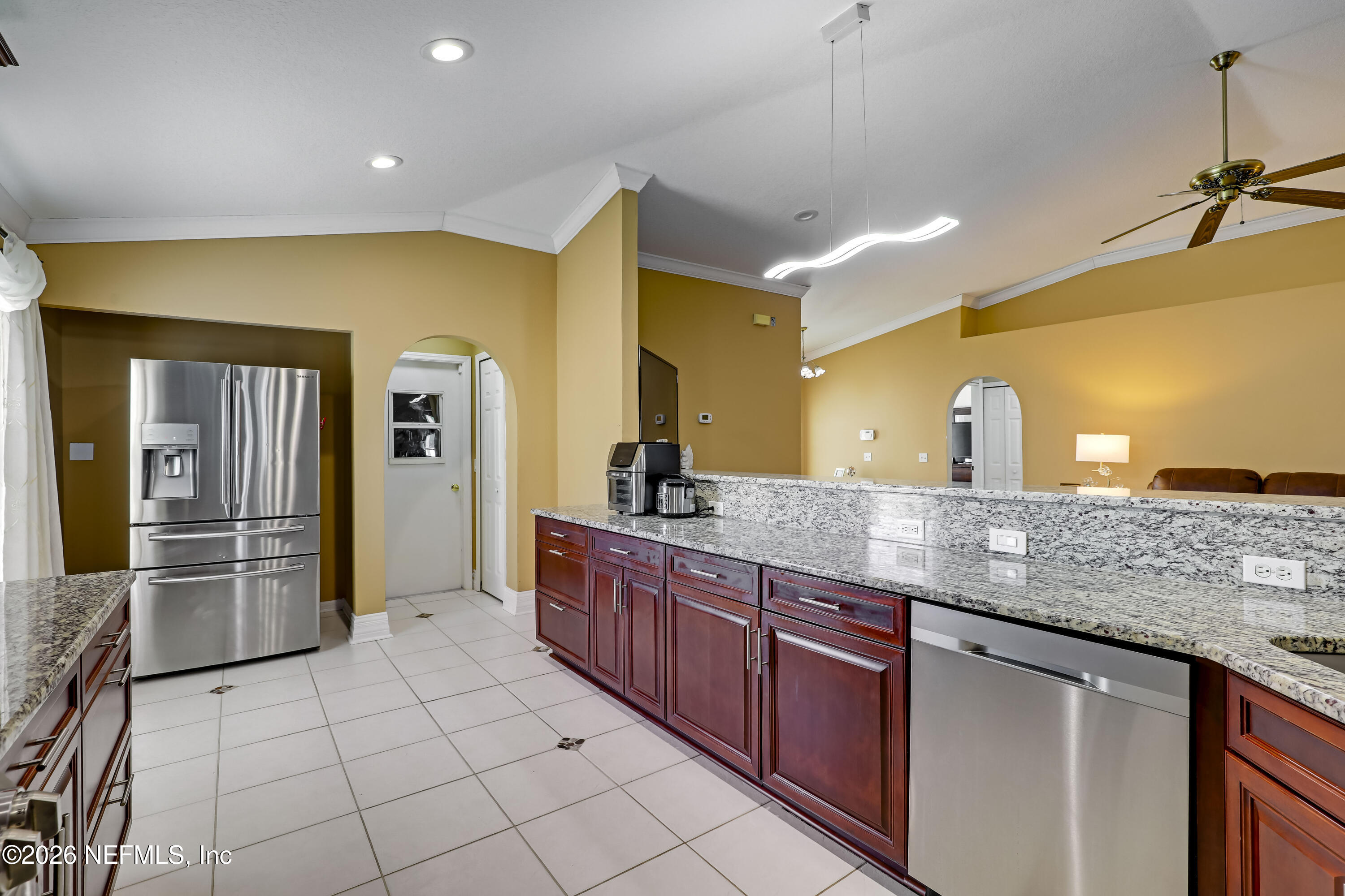 12559 Reeding Ridge Drive North Jacksonville, FL 32225 - Photo 20 of 42 a kitchen with stainless steel appliances granite countertop a sink and cabinets