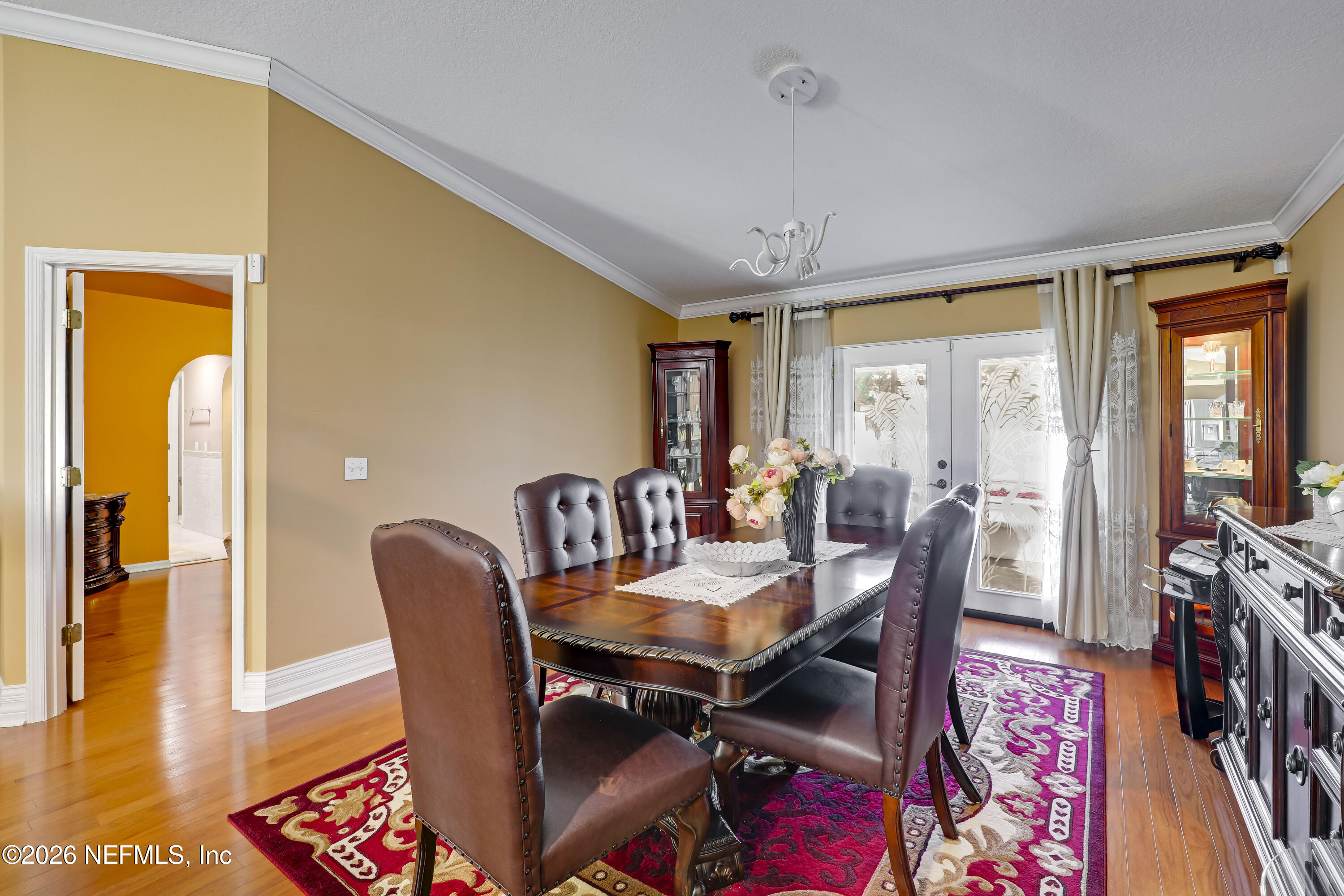 12559 Reeding Ridge Drive North Jacksonville, FL 32225 - Photo 25 of 42 a view of a dining room with furniture and wooden floor
