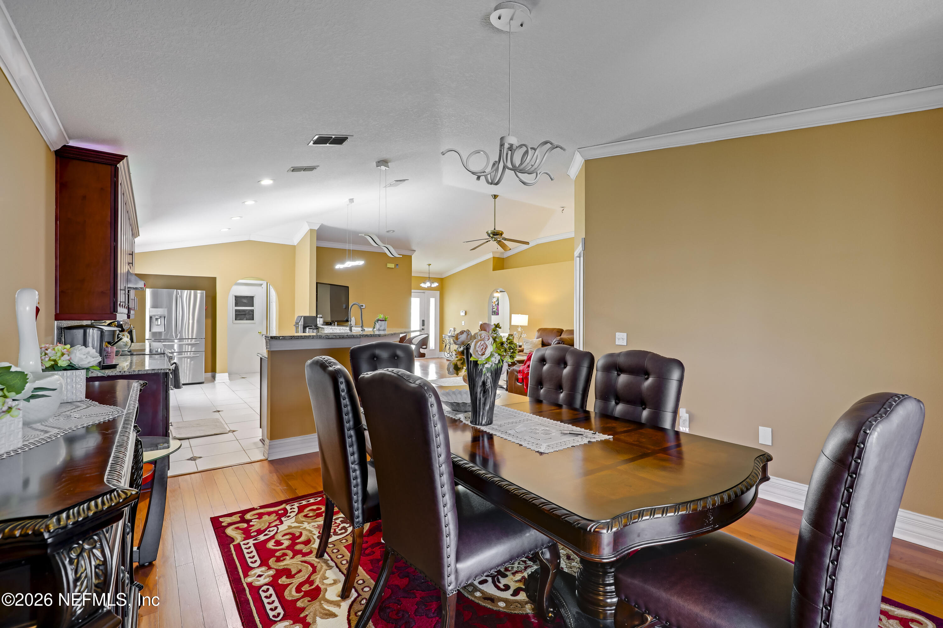 12559 Reeding Ridge Drive North Jacksonville, FL 32225 - Photo 26 of 42 a view of a dining room with furniture and wooden floor