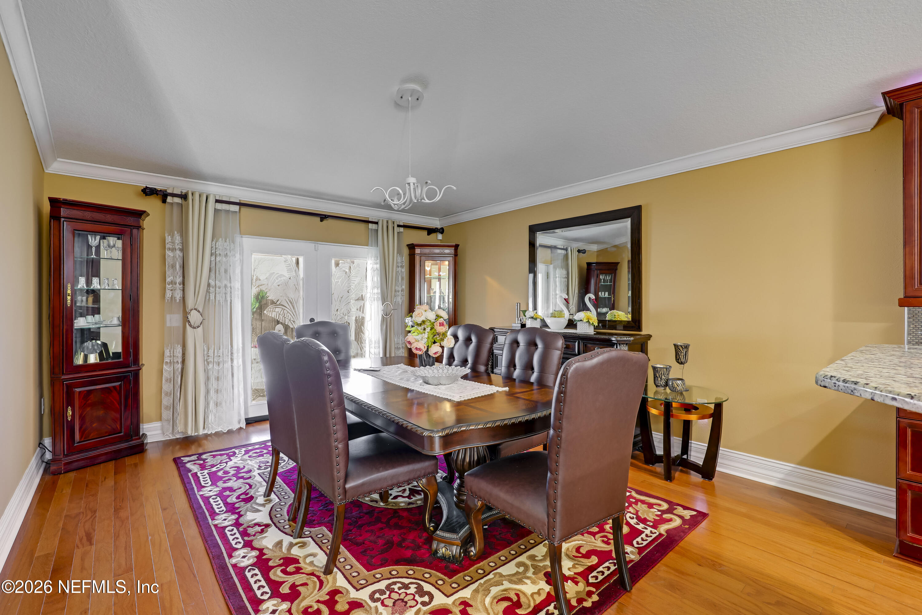 12559 Reeding Ridge Drive North Jacksonville, FL 32225 - Photo 27 of 42 a dining room with furniture and wooden floor