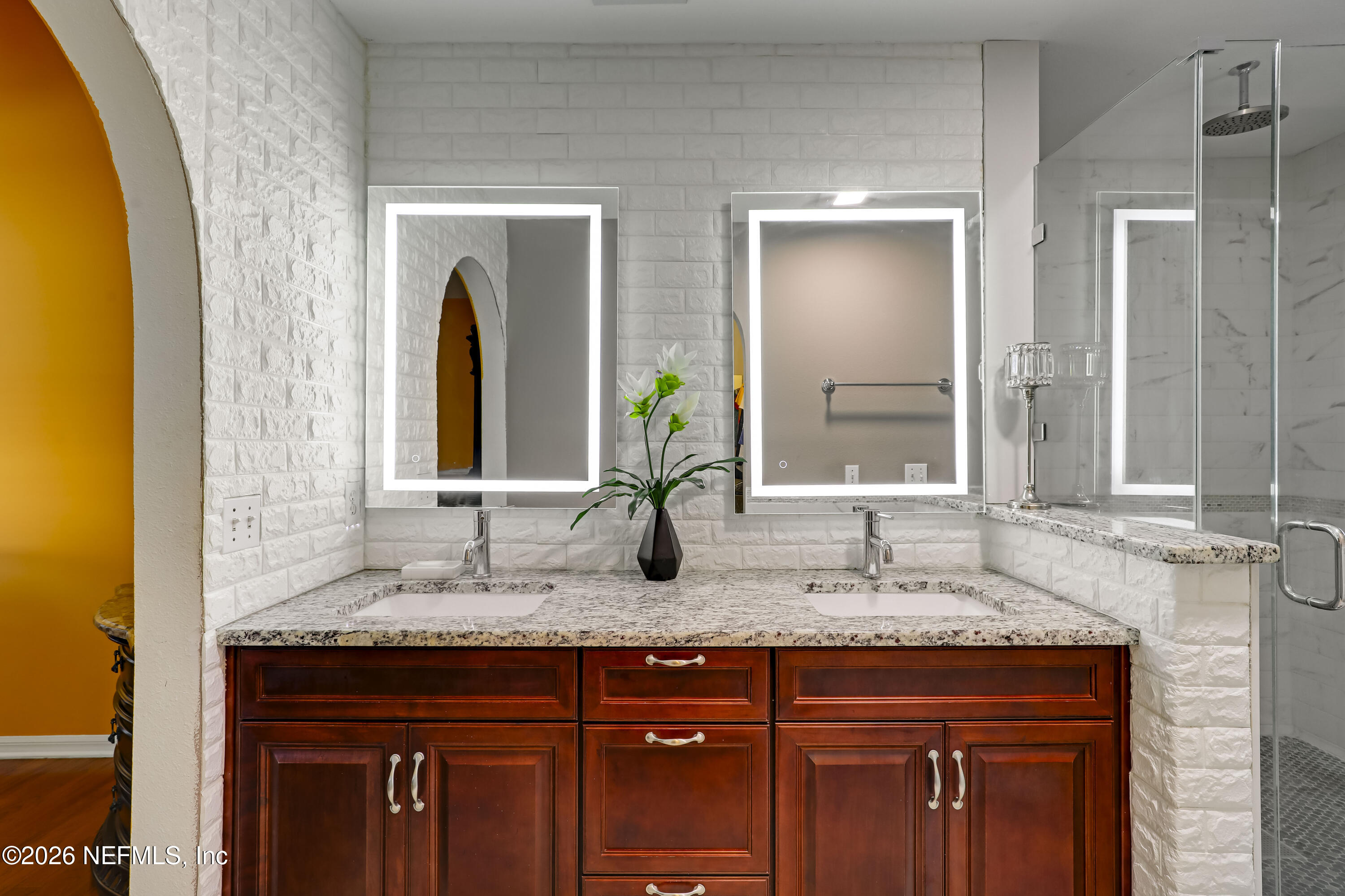 12559 Reeding Ridge Drive North Jacksonville, FL 32225 - Photo 32 of 42 a bathroom with a granite countertop sink and a mirror