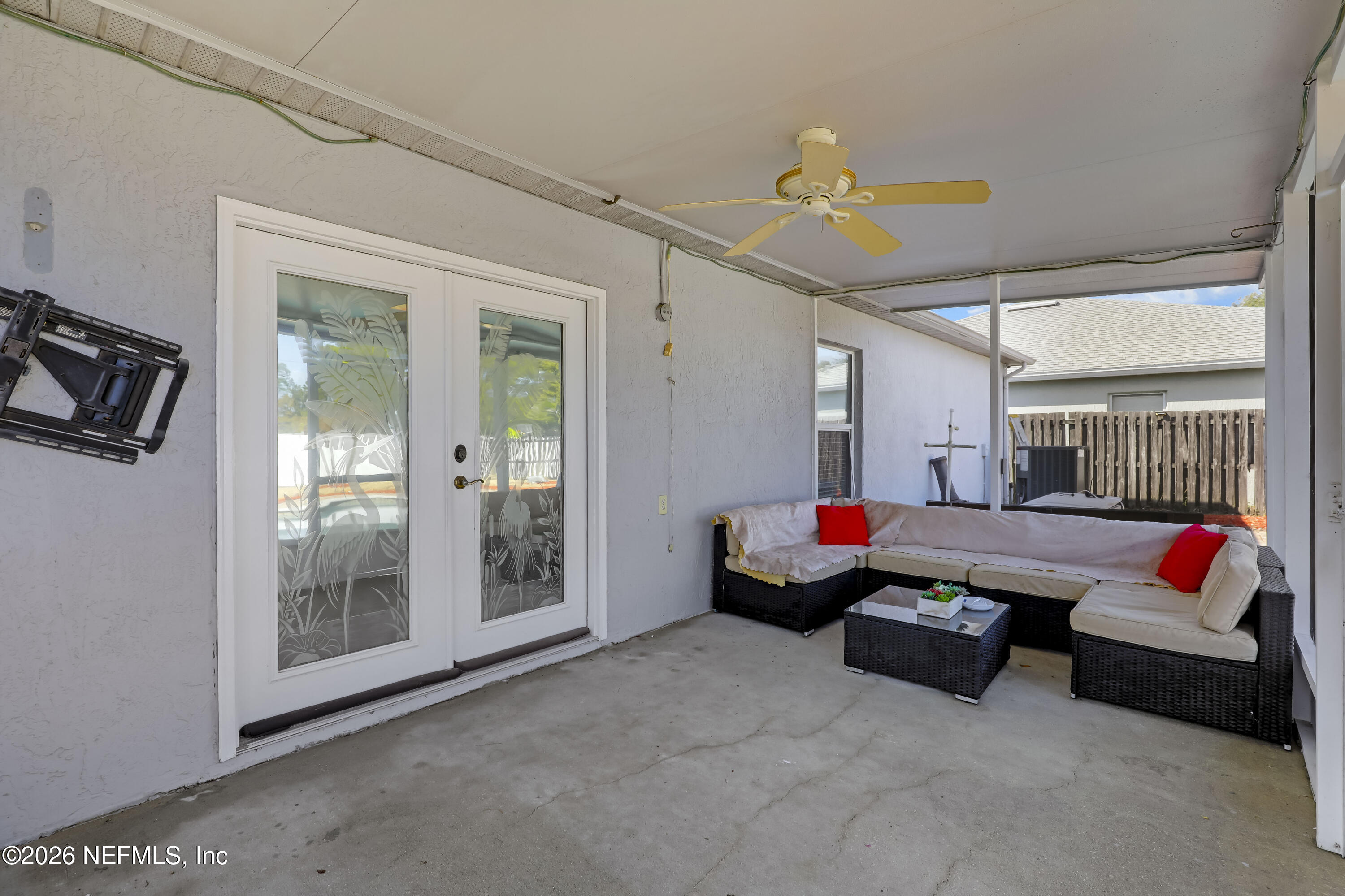 12559 Reeding Ridge Drive North Jacksonville, FL 32225 - Photo 36 of 42 a living room with furniture gym equipment and a chandelier