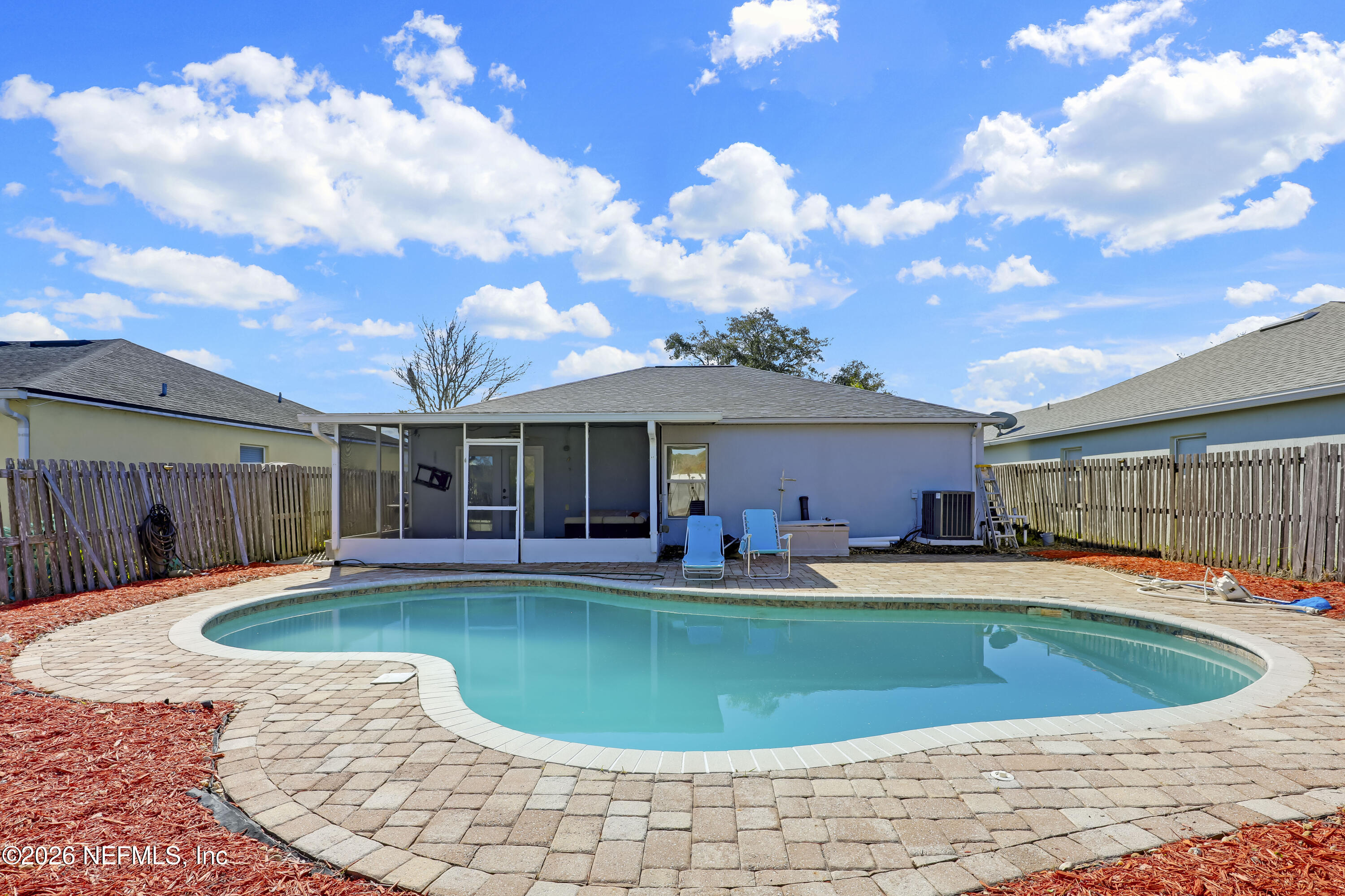 12559 Reeding Ridge Drive North Jacksonville, FL 32225 - Photo 40 of 42 a swimming pool with outdoor seating yard and patio