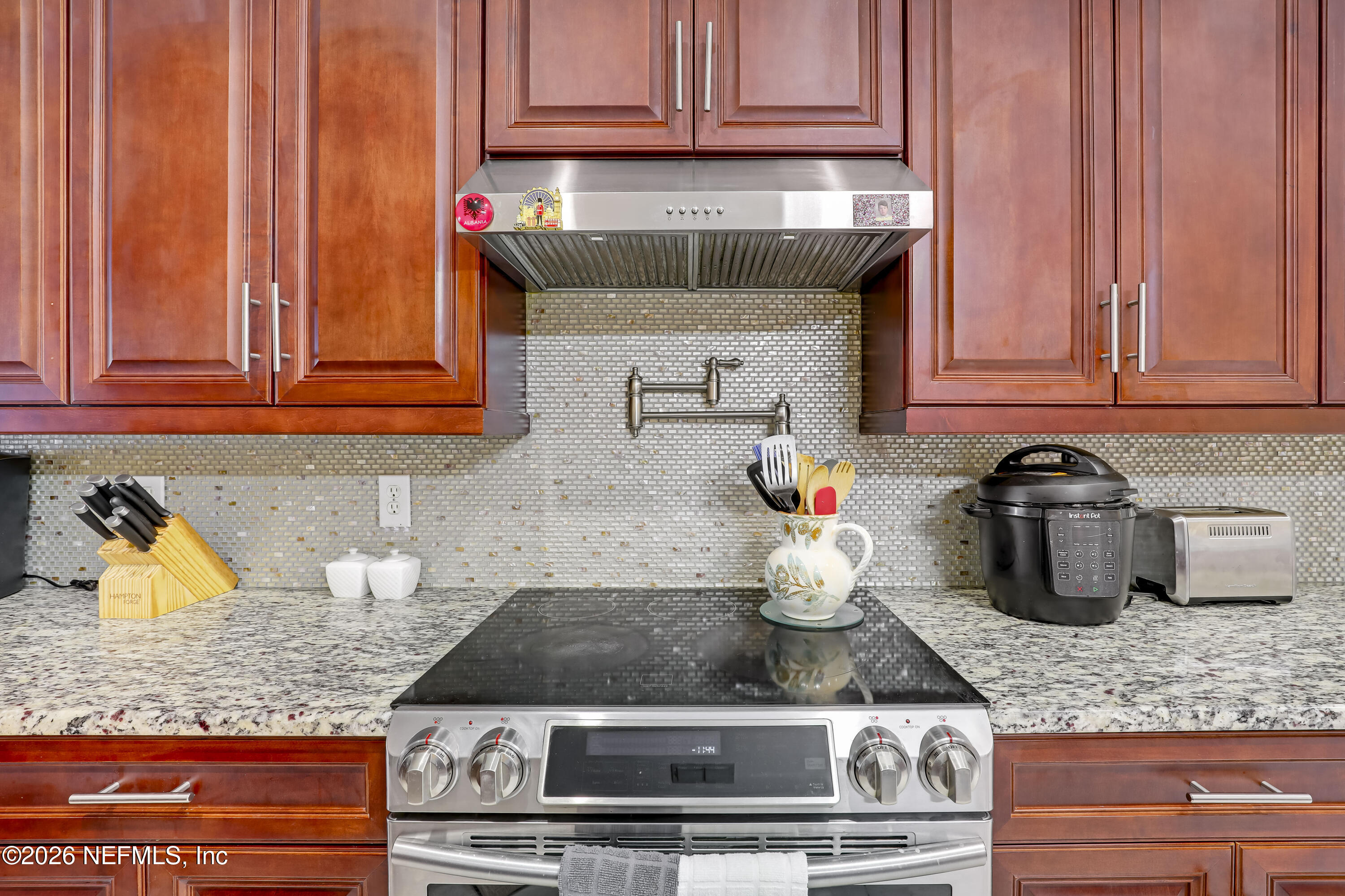 12559 Reeding Ridge Drive North Jacksonville, FL 32225 - Photo 5 of 42 a kitchen with stainless steel appliances granite countertop a sink and cabinets