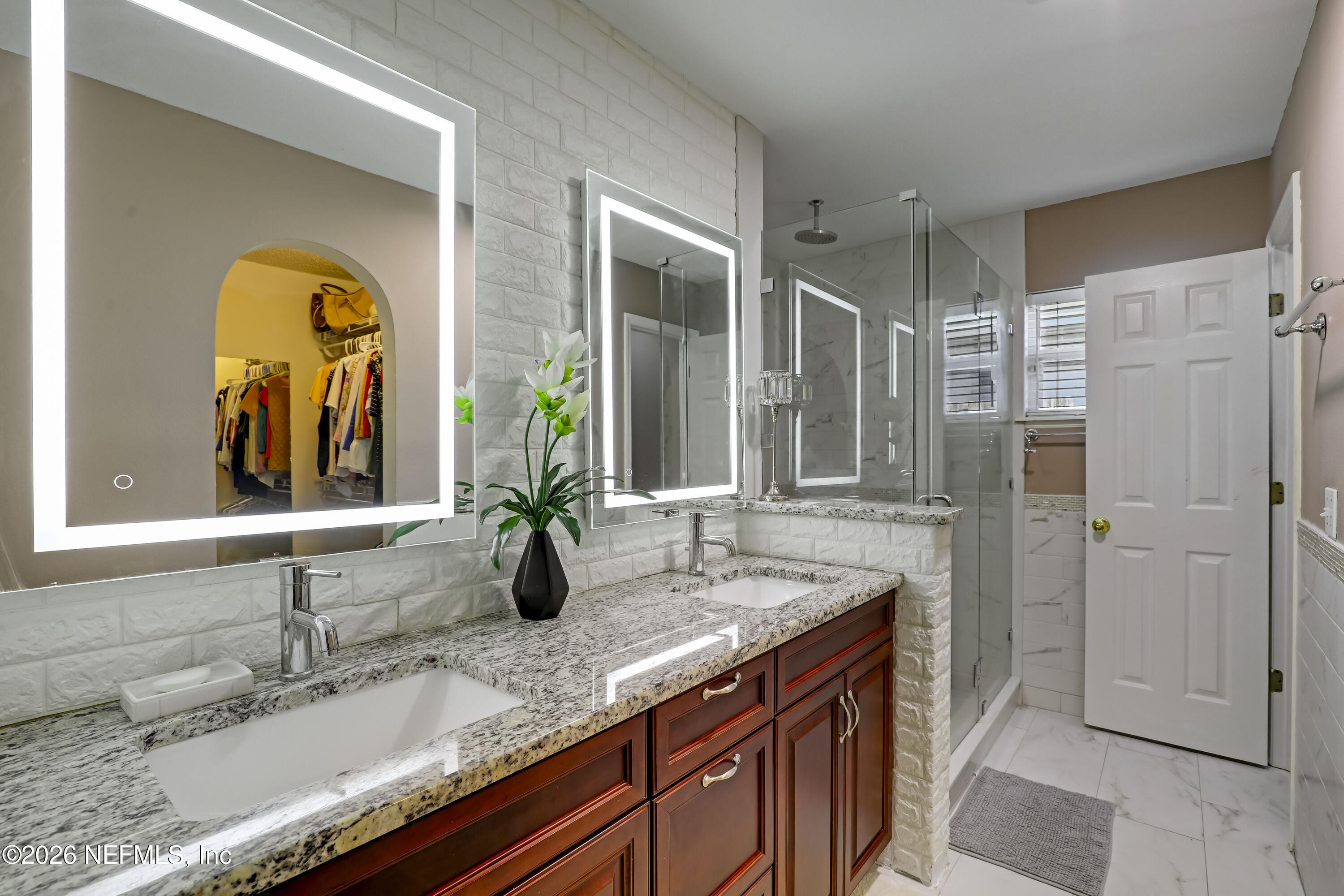 12559 Reeding Ridge Drive North Jacksonville, FL 32225 - Photo 6 of 42 a bathroom with a granite countertop sink and a mirror