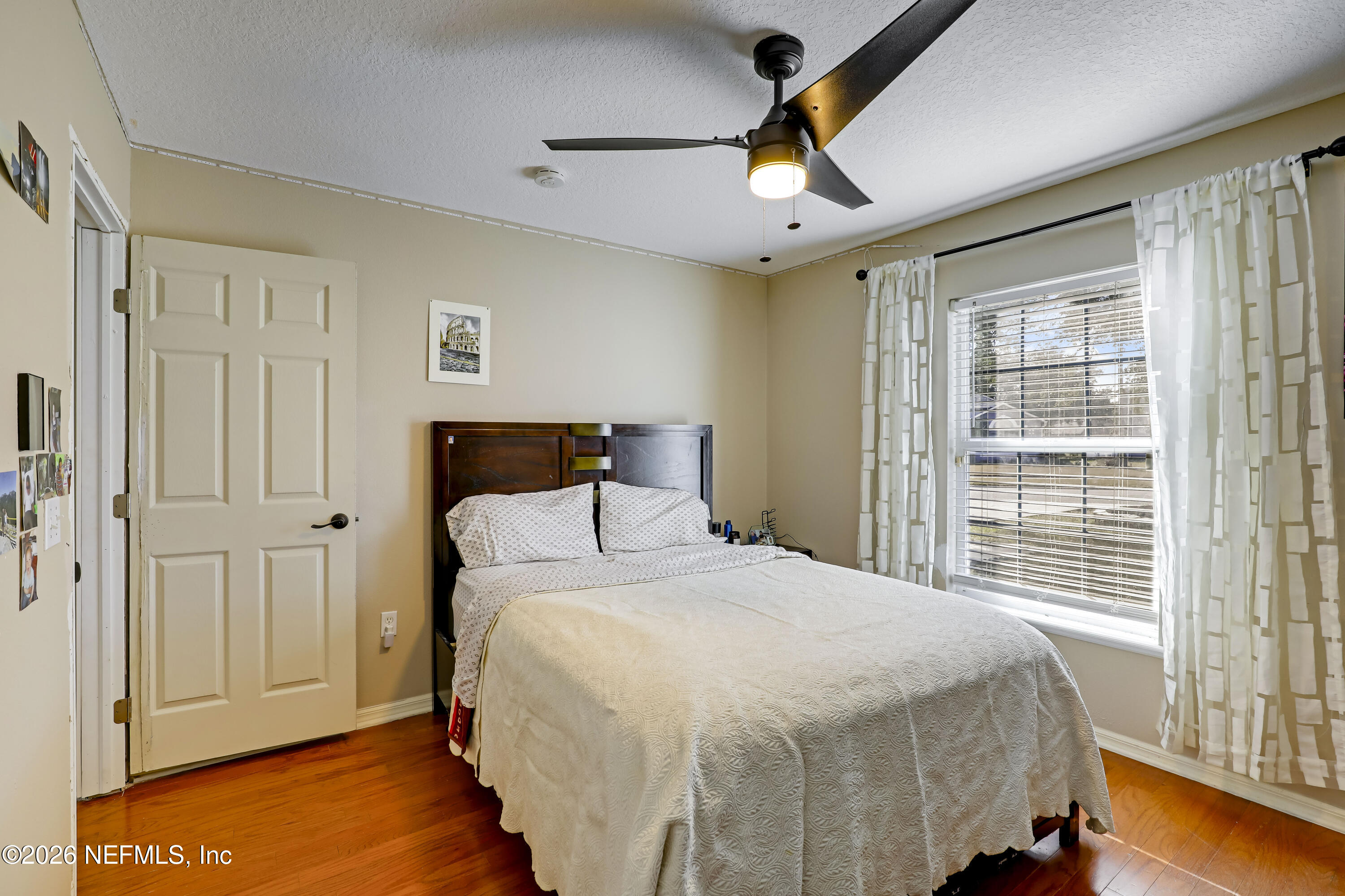 12559 Reeding Ridge Drive North Jacksonville, FL 32225 - Photo 10 of 42 a bedroom with a bed and a chandelier