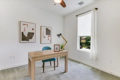 a room with furniture and a window