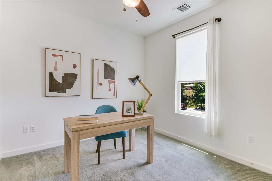 1916 Bunche Road Austin, TX 78721 - Photo 18 of 22 a room with furniture and a window