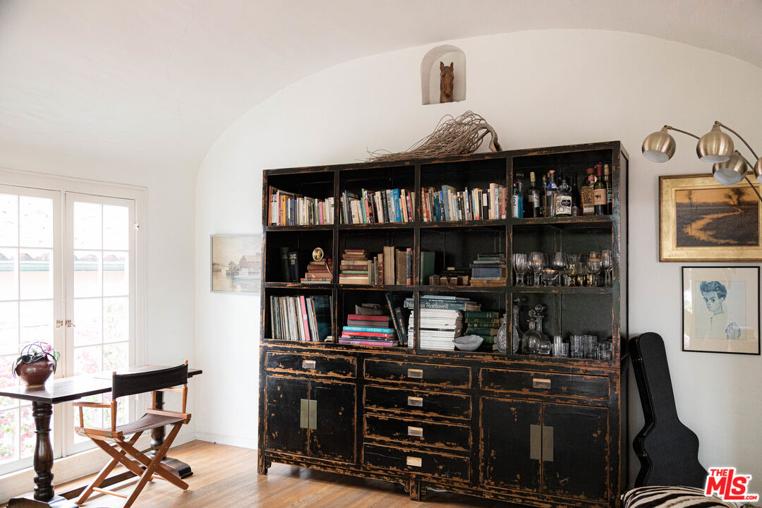 1515 Murray Circle Los Angeles, CA 90026 - Photo 20 of 40 a bedroom with a bed and a book shelf