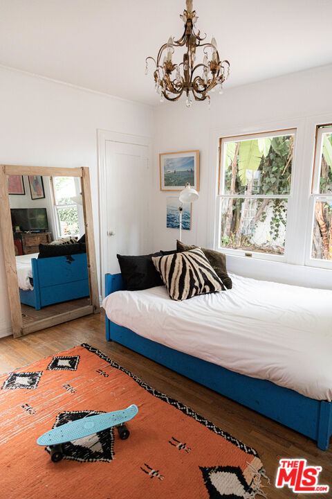 1515 Murray Circle Los Angeles, CA 90026 - Photo 8 of 40 a bedroom with a bed and dresser