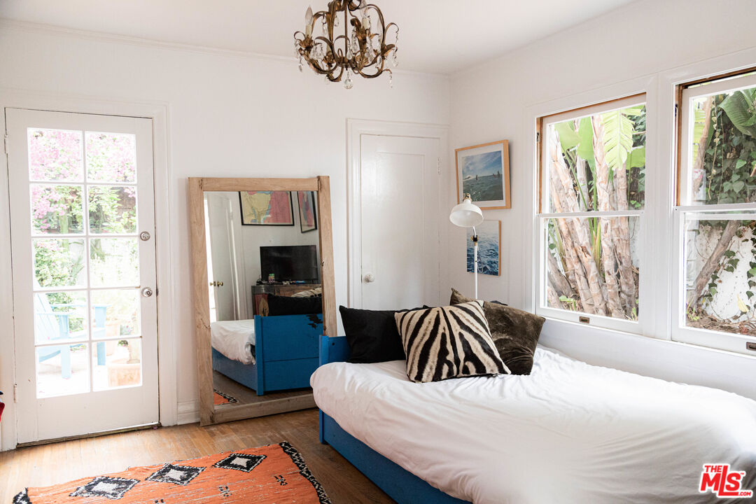 1515 Murray Circle Los Angeles, CA 90026 - Photo 9 of 40 a bedroom with a bed and wooden floor