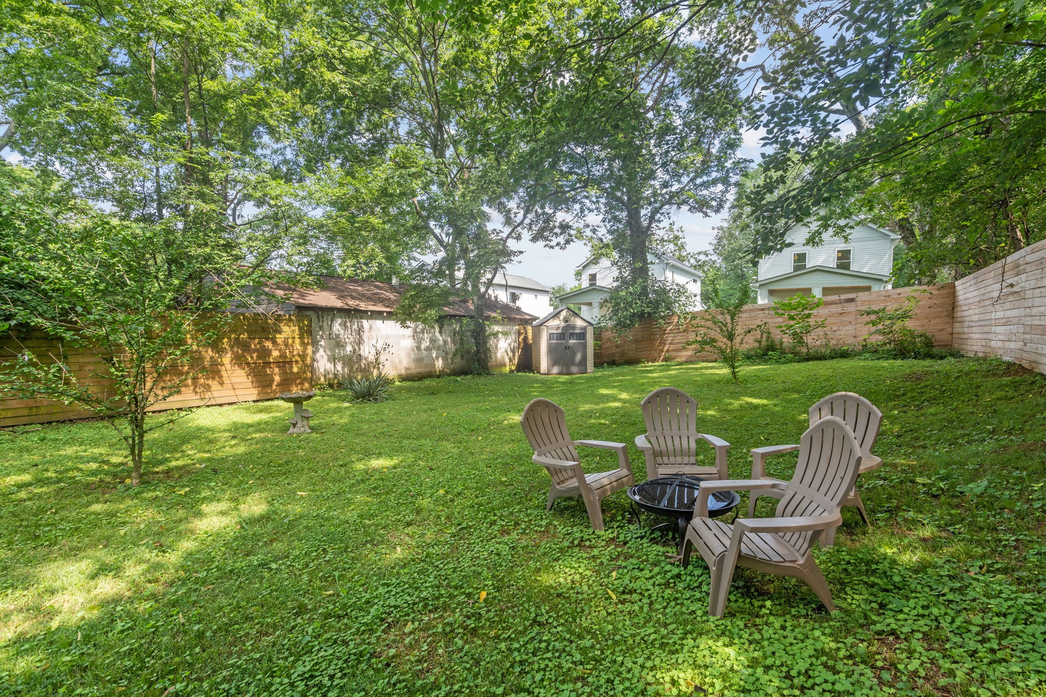 337 Duke Street Nashville, TN 37207 - Photo 11 of 28 a view of a table and chairs in the garden