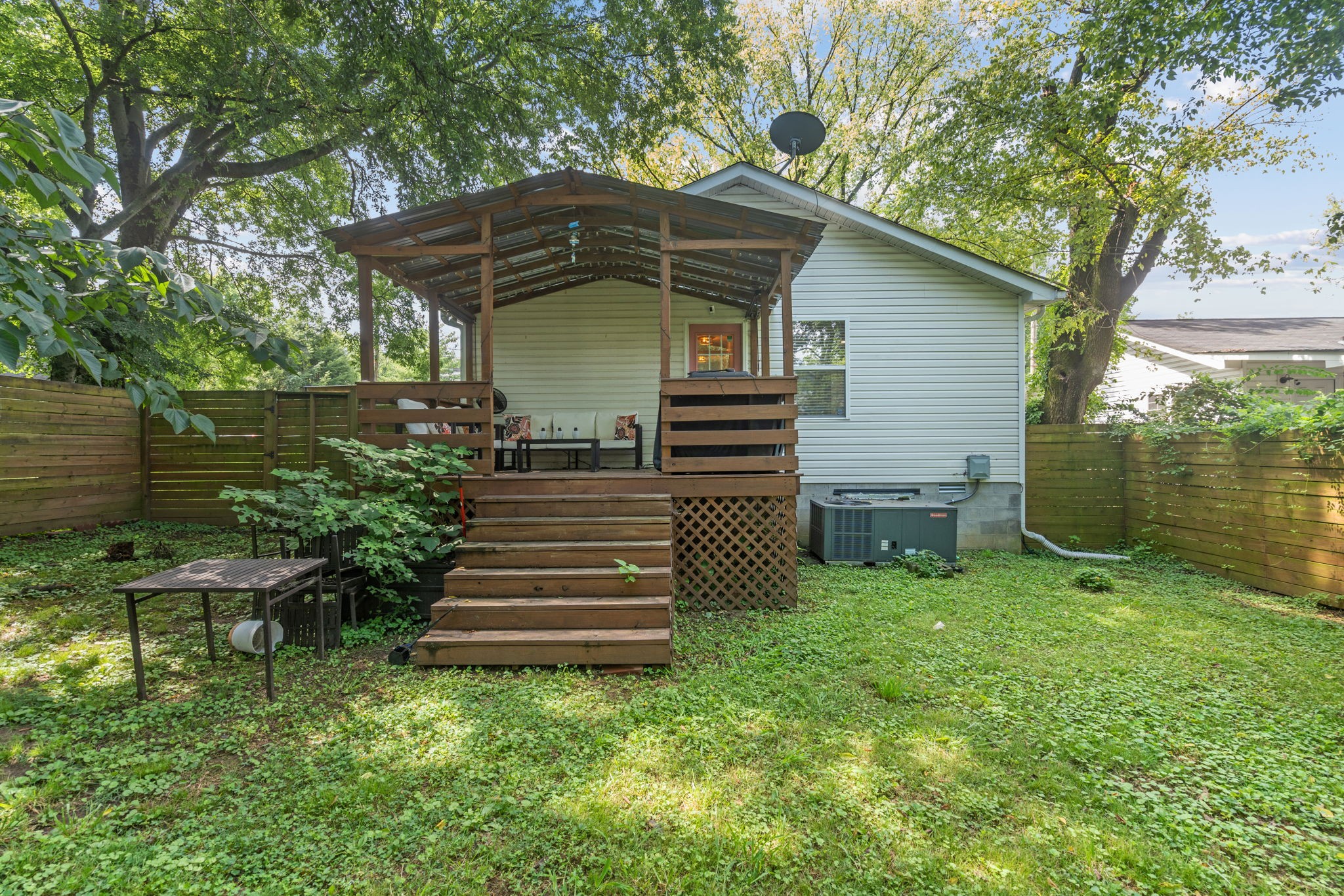 337 Duke Street Nashville, TN 37207 - Photo 10 of 28 a view of a chair and table under an umbrella