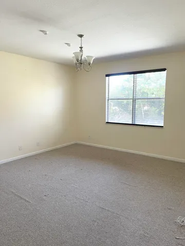 a white toilet sitting next to a shower