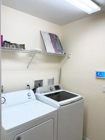a view of a livingroom with a chandelier fan