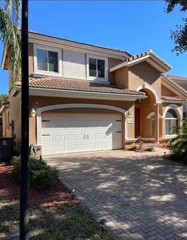 a view of a house with a street