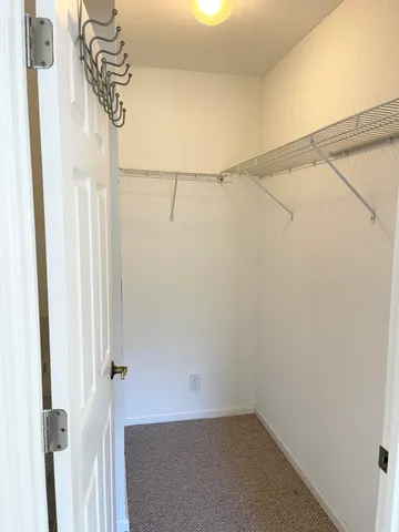 a kitchen with stainless steel appliances a stove a sink and a microwave