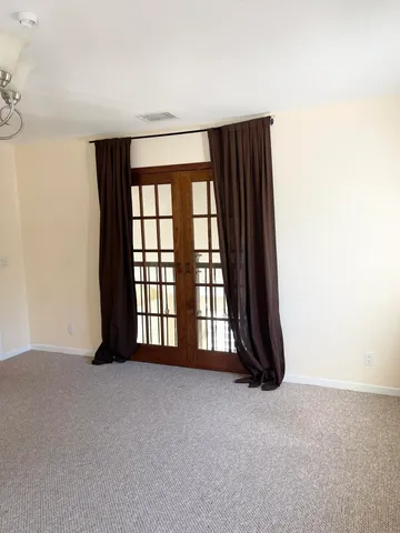 a kitchen with a sink and a stove top oven