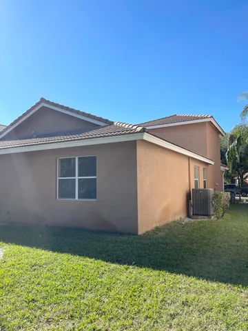 a view of a swimming pool with an outdoor space and seating area