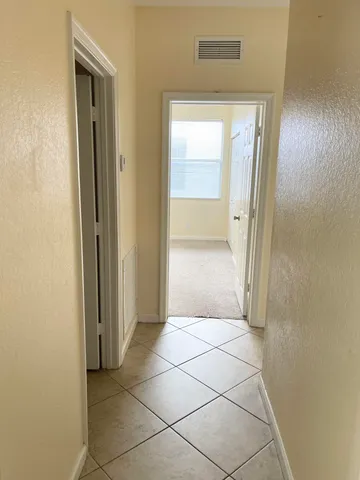 a bathroom with a shower and a sink