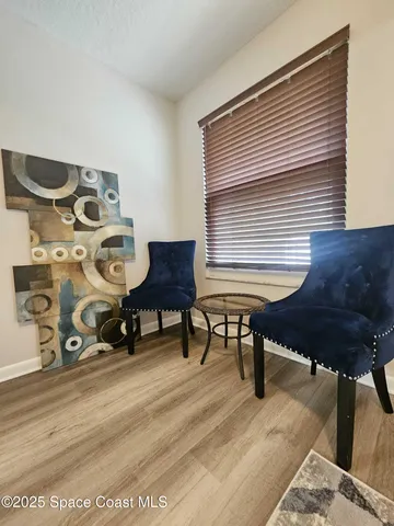 a view of a workspace with furniture