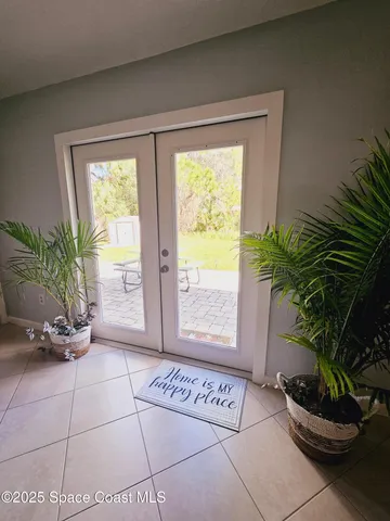 a view of an entryway with a potted plant