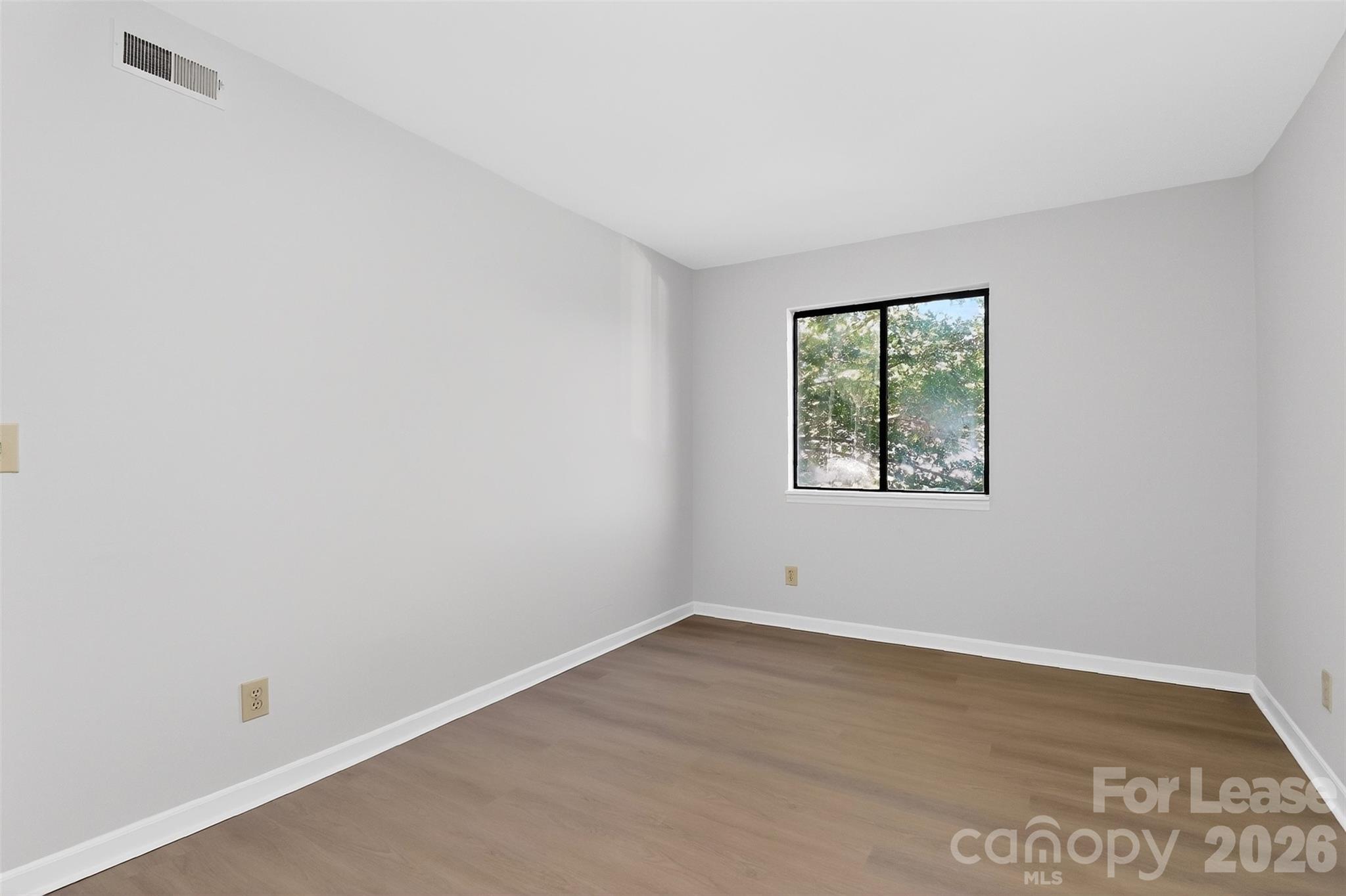 11029 Harrowfield Road Charlotte, NC 28226 - Photo 27 of 41 an empty room with a window