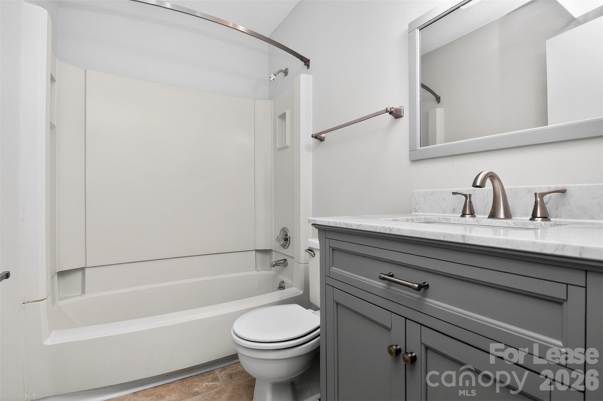 11029 Harrowfield Road Charlotte, NC 28226 - Photo 28 of 41 a bathroom with a sink a toilet and a bathtub